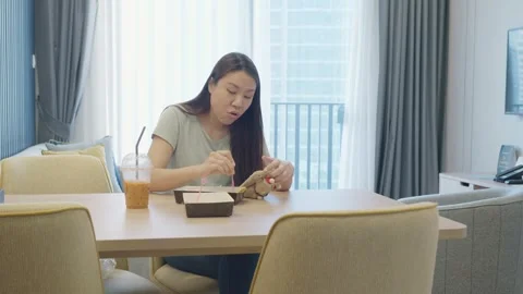 Enjoying a Meal at a Cozy Dining Table Stock Footage 327973785