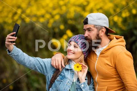 Enjoying nice weekend together. Autumn fashion portrait of couple with autumnal Stock Photos