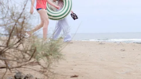 Enjoying a Playful Day at the Beach with a Float and Lots of Fun Stock Footage 316522056