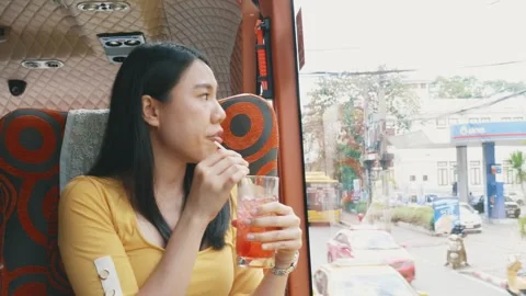 Enjoying a Refreshing Drink on the Bus Stock Footage 314637630