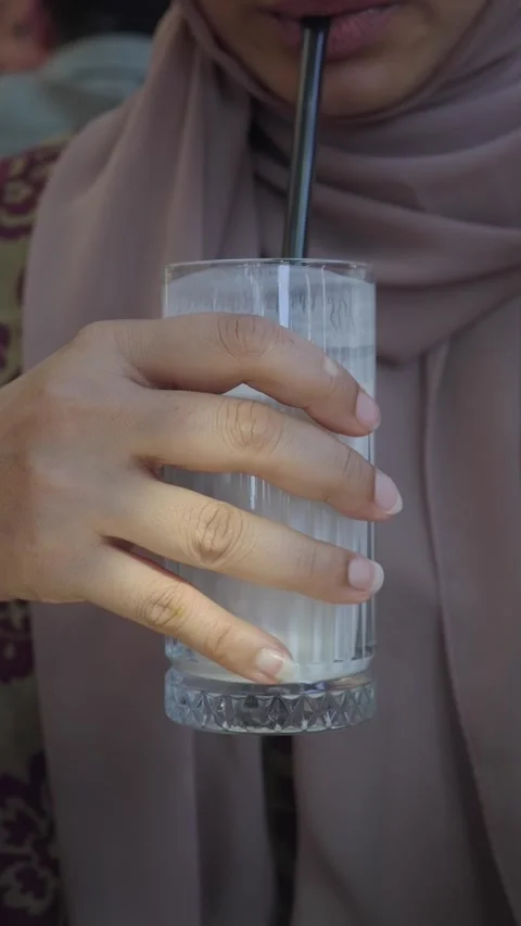Enjoying a refreshing drink in a local cafe Stock Footage 342088805