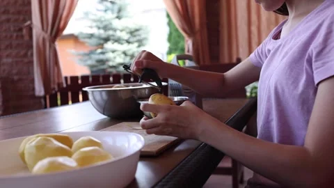 Enjoying a refreshing drink while relaxing in a sunny garden Stock Footage 297358650