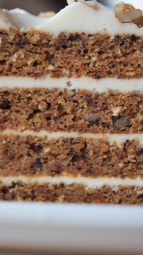 Enjoying a slice of carrot cake at a local cafe Stock Footage 339755670