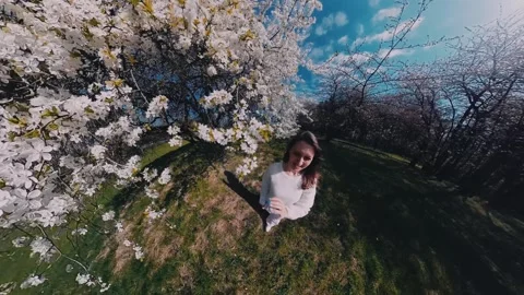 Enjoying spring blossoms in a park while capturing natures beauty Stock Footage 308659255