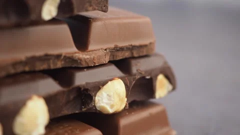 Enjoying a stack of delicious chocolate bars Stock Footage 317281685
