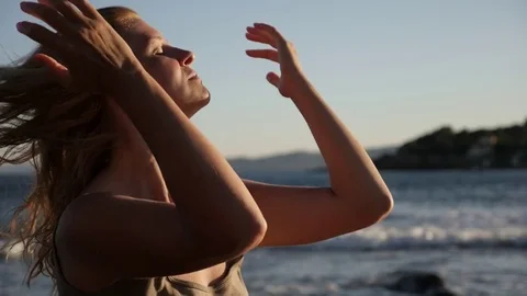 Enjoying sun on the beach slow motion Stock Footage 80494422