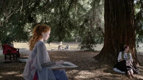 Enjoying a sunny day in the park while drawing with a friend Stock Footage 327948549