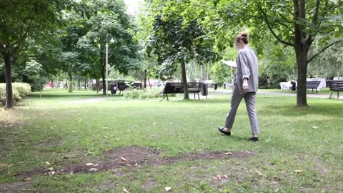 Enjoying a sunny picnic while preparing fresh fruit in the park Stock Footage 297181090