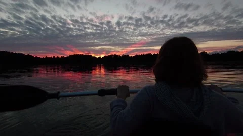Enjoying the sunset while being on kayak Stock Footage 150901383