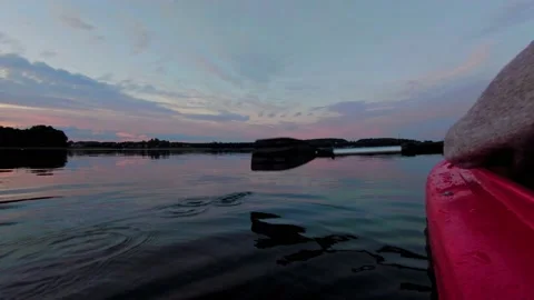 Enjoying the sunset while being on kayak Stock Footage 150901396
