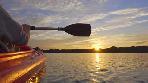 Enjoying the sunset while being on kayak Stock Footage 150901424