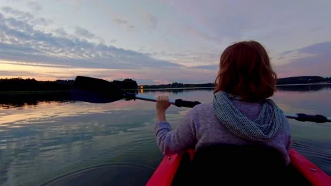 Enjoying the sunset while being on kayak Stock Footage 150901530