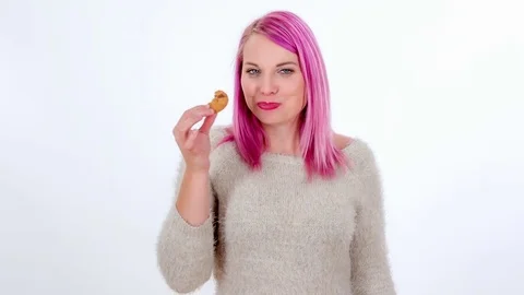 Enjoying the taste of a cookie Stock Footage 83724635