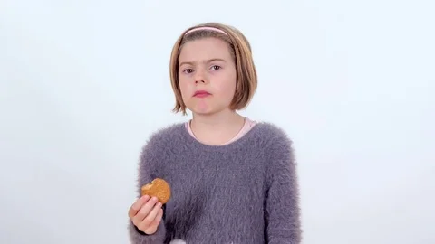 Enjoying the taste of a cookie Stock Footage 83724866