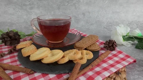 Enjoying Tea with Cookies on Table Setting for Relaxing Moments Stock Footage 313359645