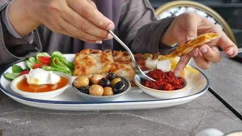 Enjoying Turkish breakfast with bread and olives in Istanbul Stock Footage 336355661