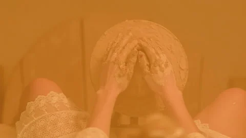 Enlarged image of a woman's hands in clay forming Stock Footage 235560653