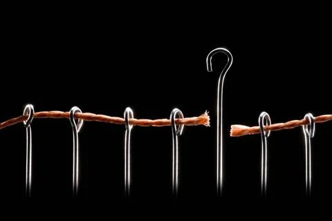 Enlightenment Pins and a brown string on a black background. Copyright: xZ... Stock Photos