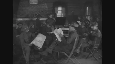 Enlisted men sit in the library and read newspapers and books - 1917-1918 Vídeos de archivo 83702769
