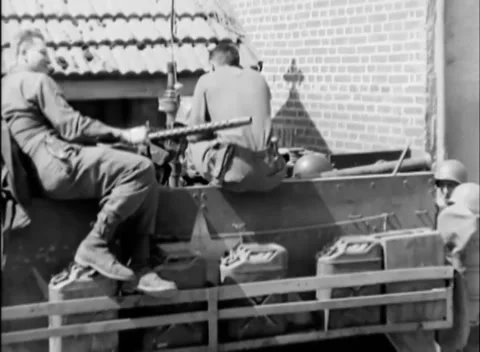 ENNS, AUSTRIA - 1945: Half-track crew - Soldiers rest aboard a half-track 库存影片 343849287