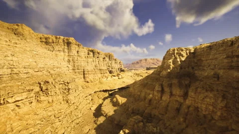 Enormous chasm displaying eroded ridges and shimmering stone faces Stock Footage 334041666