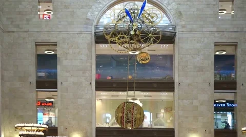Enormous clock with a large pendulum in a Detsky mir shop 스톡 동영상 60455329