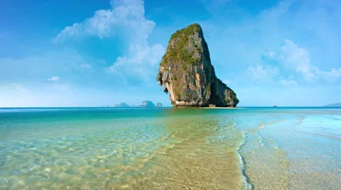 Enormous Limestone Formation Jutting Vertically from the Tropical Sea Видео 51402812