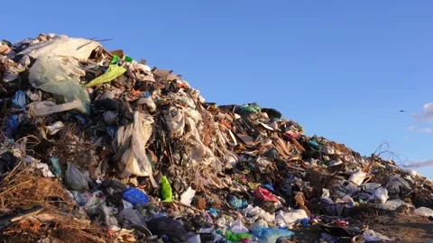 An enormous mound of garbage and assorted waste rises high into the air, wh.. Stock Footage 321918146