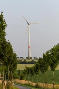 Enormous wind engine at the end of a country lane Stock Photos