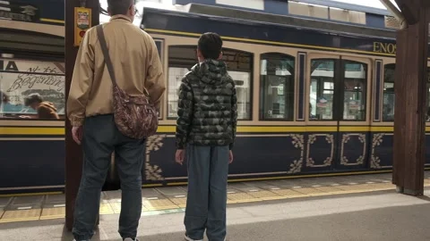 Enoshima Train coming into station Stock Footage 250565753