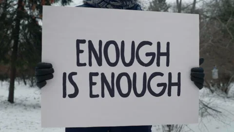 Enough is enough. Close up poster, activist against racism, discrimination Video stock 132370332
