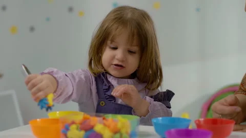 Enriching Visuals of a Girl's Interactive Learning Session with a Teacher Stock Footage 244536799
