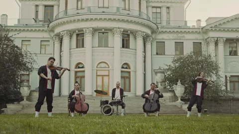 Ensemble Giving Classical Music Concert in front of Historical Building Stock Footage 280680213