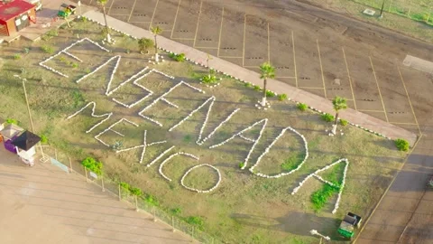 Ensenada, BC, Mexico - June 24, 2026:  Large rock sign spelling Ensenada Mexico Stock Footage 337548112