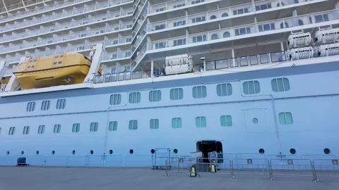 Ensenada, Mexico: March 2, 2026 - Modern cruise ship exterior with lifeboats Stock Footage 331179641