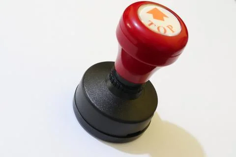 Ensuring Correct Orientation A Vibrant Red and Black Top Indicator Tool Stock Photos