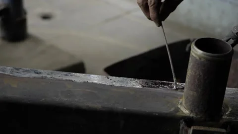 Ensuring Heating Efficiency - A Handful of Metalwork Stock Footage 320942635