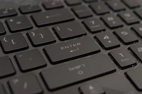 Enter on black keyboard button closeup Stock Photos