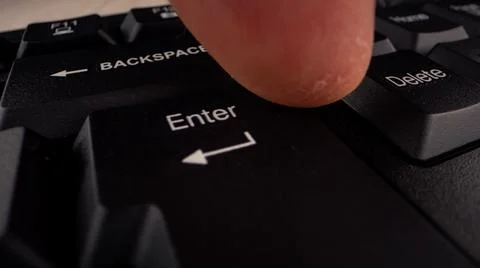 Enter button with letters and arrow sign on black keyboard Stock Photos