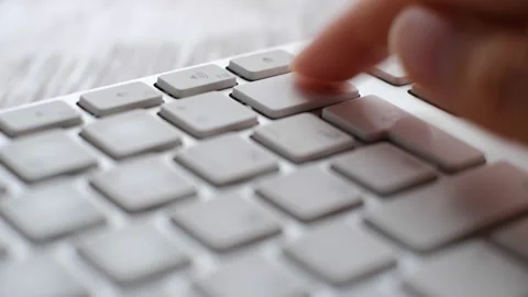 Enter button pressing on keyboard, laptop keyboard close up Stock Footage 168477845