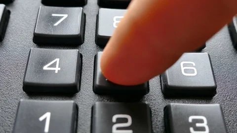 Enter the code with your finger on the buttons with numbers. Stock Footage 100129074
