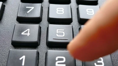 Enter the code with your finger on the buttons with numbers. Stock Footage 100129109