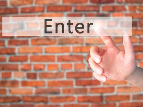 Enter - Hand pressing a button on blurred background concept on visual screen 스톡 사진