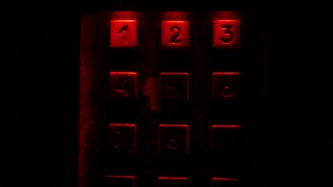 Enter number in the dark, red light. Stock Footage 97925529