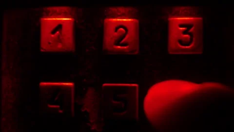 Enter number in the dark, red light. Video stock 97925593