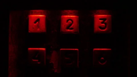 Enter number in the dark, red light. Stock Footage 97925991