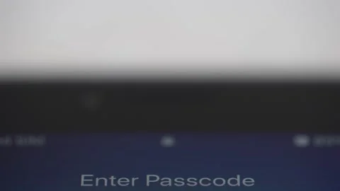 Enter passcode script on the screen of a smartphone to unlock the device. Video stock 138119451