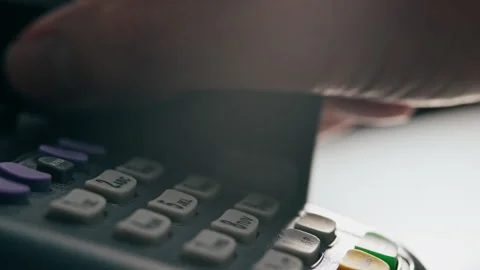 Enter the payment code, Woman in a clothing store Slowly swipes a plastic ca Stock Footage 243745361