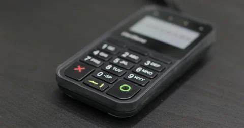 Enter pin code on terminal. Using Credit Card Terminal at shop Stock Footage 91933123
