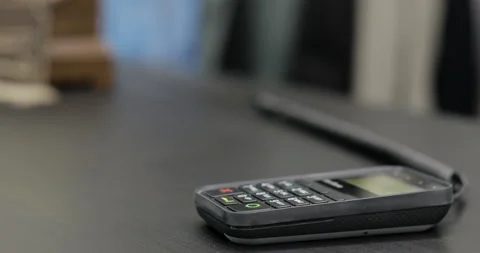Enter pin code on terminal. Using Credit Card Terminal at shop Stock Footage 91933680